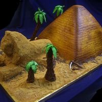Pyramid The sand is all gram cracker crumbs, the sphinx is cake as well as the pyramid. All the palms are gumpaste