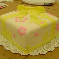 Present Cake With Yellow Bow Did this for a Wilton course 3 class. Didn't plan out my placement too well...just kind of slapped everything on as we were running...
