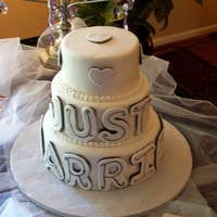 "just Married" Cake My attempt at flour girl's "Just Married" cake. 6, 8 and 10 inch rounds, fondant covered with fondant letters and hearts.