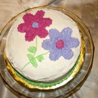 1St Cake This was my first cake from my Wilton course 1 class. I had a problem getting the icing the right consistance for the base, but my daughter...