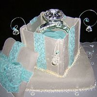 Engagement Ring Cake The ring box is made out of rolled and dried fondant. I made the ring out of fondant, covered it with foil for support and than used a...