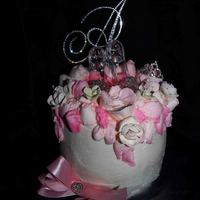 Pink Rhinestone Cake Three layer lemon cake with cheesecake filling. Decorated with pink roses and rhinestones.