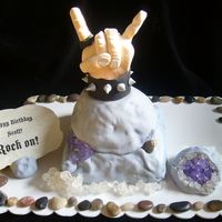 Rock On This was for my Son-In-Law who is an avid rock hunter and loves music.Pineapple cake rocks covered with Satin Ice fondant. The hand was...