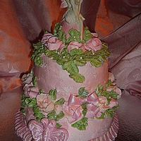 Fairy Pink Cake Two tier cake iced and decorated in buttercream.