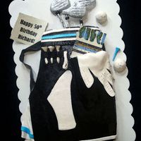 Golf Bag Cake Chocolate cake iced in buttercream covered with satin ice fondant.