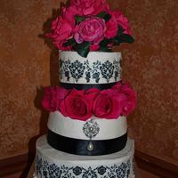 Rachael & Kiel's Couples Shower Cake Decorated with buttercream, edible damask transfers and fresh roses.