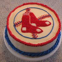Red Sox Baseball Logo Cake I made this for my husband's birthday. He's a huge BoSox fan. It is a super-moist carrot cake with cream cheese frosting. I used...