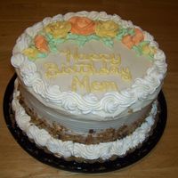 Moms Birthday Cake This is a carrot cake frosted with cream cheese frosting, roses are buttercream.