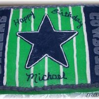 Dallas Cowboys 11x15 chocolate cake with butter cream icing, The words and star were transfered using the pin prick method.Go Cowboys!!!