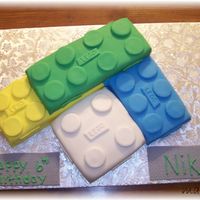 Lego Cake This was a cake I did for a 6 year old's birthday. Yellow and Choc. Cake topped with MMF