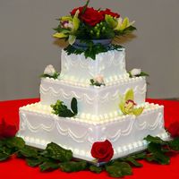 Cakes8_020.jpg 14, 10, 6" squares. All buttercream with a bead design on sides and fresh flowers.