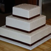 Cakes8_277.jpg 16, 12, and 8 in. Buttercream with fabric ribbon.