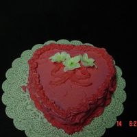 Valentine Cake My heart cake, with buttercream icing.....Lilies is made out of Royal icing..