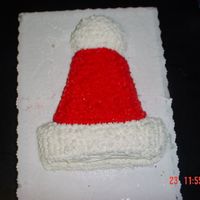 Santa Hat I made this cake for my Boyfriends, Mother Christmas Eve Party.....I used party hat pan and star the icing......I know I got the Stars down...