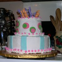 My First "whimsy" Cake Vanilla and chocolate cakes with BC with fondant accents. I'm not feeling very confident about this...and I'm hoping my sister in...