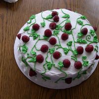 Raspberry Cake French Vanilla cake with homemade raspberry filling. BC icing. Fresh raspberrys on top