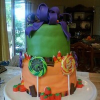 Halloween Themed Cake Based on a cake I saw online. Sorry I can't remember who the original artist is. My first stacked fondant cake. I've only...