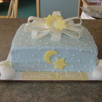 Stars And Moon Baby Shower Cake cake is buttercream- bow, booties, stars and moons made out of fondant