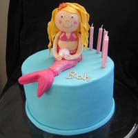 Mermaid Figurine Cake This was a cake order for a little girl's 4th birthday. Chocolate mudcake with fondant and an edible mermaid figurine on top - I had...