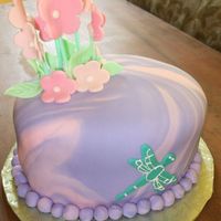 Flower Garden This was done for a girl's second birthday. Covered in marbelized fondant with fondant and royal icing decorations.