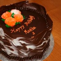Birthday For Co-Workers Devil's food cake with dark chocolate mousse. Top of cake has chocolate ganache glaze. Outside is wrapped in marbled chocolate