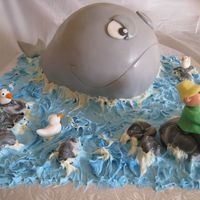 Fisherman And Whale This little fisherman is in for a big surprise!!!!The whale is the cake, the water is buttercream and everything else is fondant.
