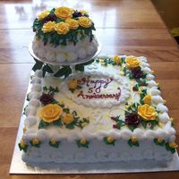 50Th Wedding Anniversary The pictures turned out dark as I never turned the flash on...the reddish roses are actually a burgundy. The cake is a 14 inch square with...