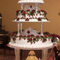 Cascade Of Burgandy Roses I am new to this board, and this is my most recent wedding cake. I am really quite pleased with the color results.