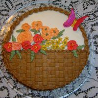 Flower Basket My mom's birthday cake. She wanted anything with flowers. I thought I did alright until I realized you can see through the basketweave...