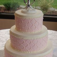 Pink & White Diamon Impression This was such a simple cake to do but I just love the way it looks. 3 Tiered Red Velvet w/ Bavarian Creme filling and Iced in Buttercream....