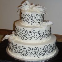 Black Scrollwork & White Calla Lilies This is 6", 9" & 12" - all iced in Buttercream. The black scrollwork is also done in Buttercream. The bride specifically...