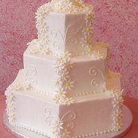 Daisies & Swirls This is #2 of Several Dummy Cakes I did for my display window. It's Iced in Buttercream icing and the daisies are fondant. I actually...