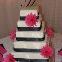Black/fusia Daisy Wedding Cake This is my favorite wedding cake that I've done so far. It's all buttercream icing, the ribbon is satin and is held on with...