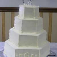 Hexagon Cake This cake is all white, with white monogrammed inititials on it, that's what the bride wanted. She brought me a pic, and that's...