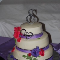 Rebecca's Wedding Cake Covered in MMF, Gumpaste roses. I saw this cake in a book and was dying to try it. Hope I did it justice!