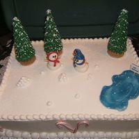 Frosty The Snowmen :) Made this winter themed cake for a Daycare Christmas Party.Fondant snowmen, royal icing trees.