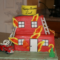 Firetruck And Burning Building. This was for a friend's son who had a fire engine themed birthday. The truck is his toy and not edible.