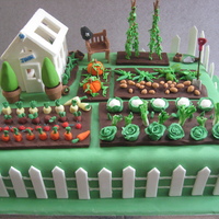 Vegetable Garden Cake 50th birthday cake for a keen gardener. He's also a policeman, hence the helmet on the bench