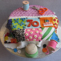 70Th Birthday Cake - Sewing Basket With Patchwork Quilt This cake was for a 70th birthday. The lady is very keen on patchwork quilting.All the bits and pieces are made of gum paste or fondant and...