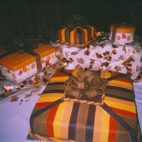 Wedding Cake This was my first wedding cake. The bride wanted fall colors and presents. The cakes are all done in MMF.