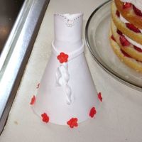 Closer Shot Of Dress The flowers are made out of fondant; the white flower is royal icing. The dress, pastillage.