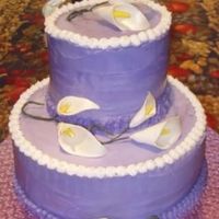 Purple Bridal Shower Cake With Sugar Calla Lilies Purple buttercream tiered shower cake with handmade sugar calla lilies.
