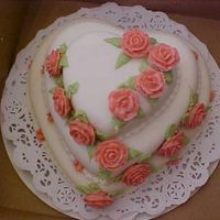 Valentine's Day Cake I made this cake for a coworker. She won it as part of a fundraiser. It's red velvet with cream cheese frosting, covered in fondant....