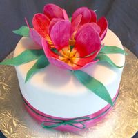 Open Tulips These flowers have really amazing centres. I opened them out to show them off. Tulips and leaves done in gumpaste. Chocolate fudge cake...