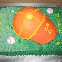 Baseball Cap Birthday cake for a friend's child. Chocolate sheet cake and half sportball cake. The bill of the cap is orange candy melts. Iced in...
