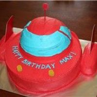 Disney's Little Einsteins Rocket Cake I MADE THIS FOR A FRIEND'S SON. I USED A 9 INCH ROUND FOR THE BOTTOM, HALF OF THE 3D SPORTS BALL FOR THE DOME, AND THEN TWO TWINKIES...