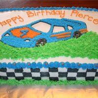 Race Car Cake I TRACED THE OUTSIDE IMAGE OF THE CAR ONTO THE CAKE THEN FREE HANDED THE DETAILS. I LOVE USING THE 'GRASS' TIP SO I HAD FUN WITH...