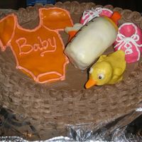 Pb100014.jpg basket of baby things made out of rice krispy treats and modeling chocolate.