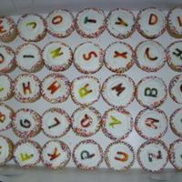 End Of School Cupcakes Mix of white and chocolate cup cakes with BC. Letters where cut out of tie died fruit roll ups.