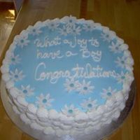 Blue Baby Shower Cake Chocolate cake with whipped buttercream icing and gumpaste daisies.